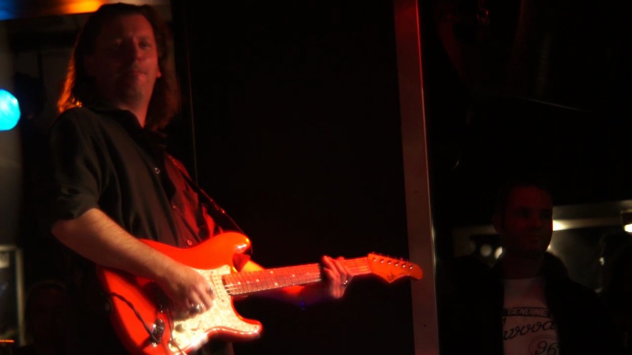 Screenshot - todd Wagner playing guitar at Quasimodo's with 55 FiftyFive